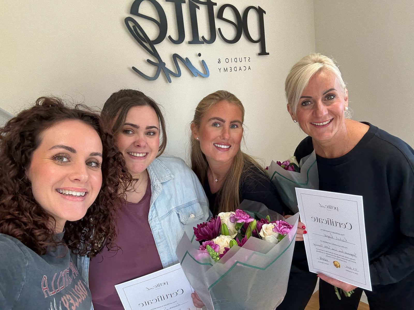 Graduates and Kayleigh on certificates day